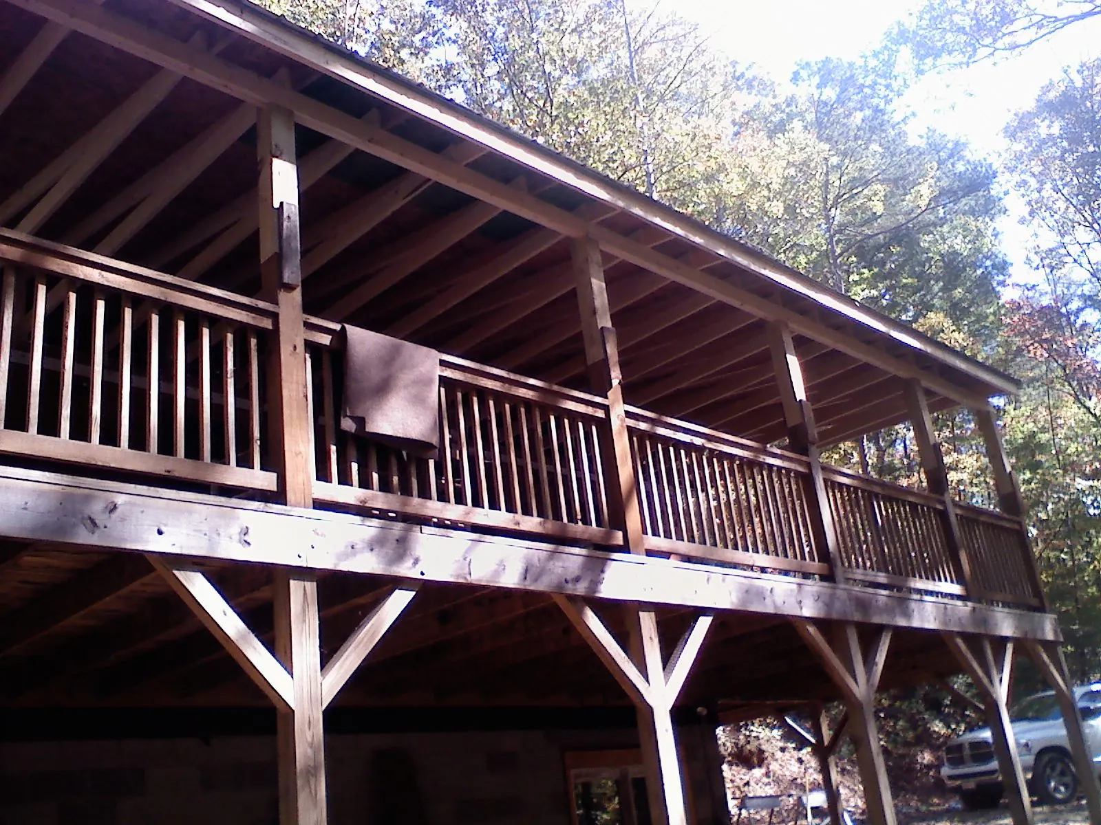 Timber framing under a new elevated porch and deck — Roof Leak Repair in South River by Roofing Brothers